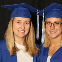 two friends smiling for a picture